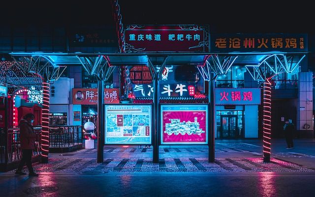 Immersive game background depicting a futuristic city at night with glowing details.