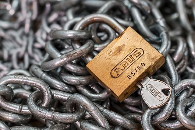 Digital padlock icon surrounded by glowing particles, symbolizing secure and fair play.